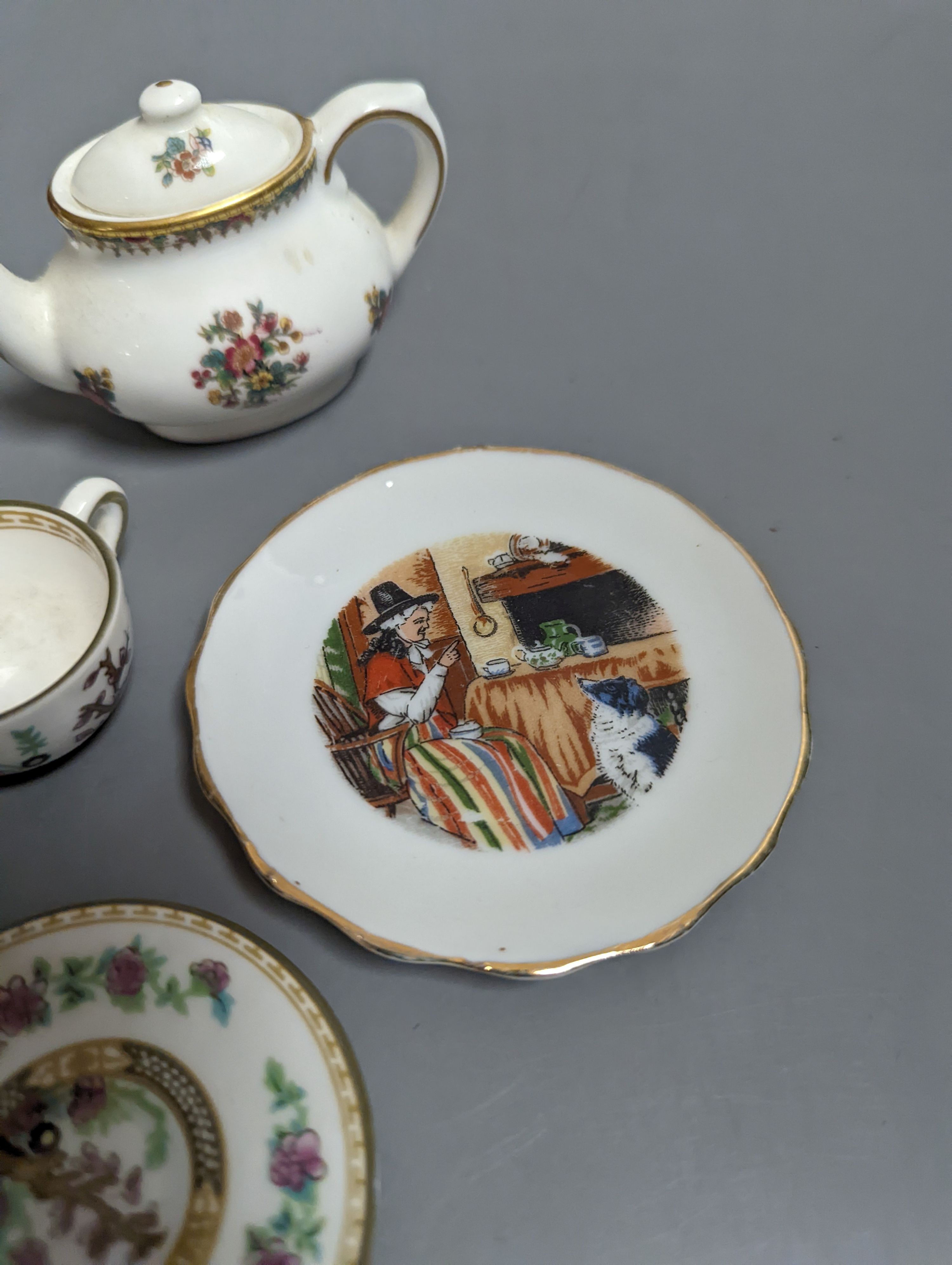 Various miniature Coalport bone china tea sets, a Staffordshire pottery moneybox and other china